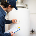 technician servicing water heater